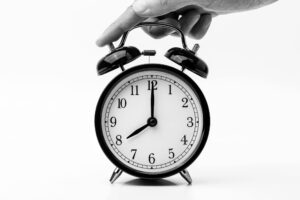 hand above a clock