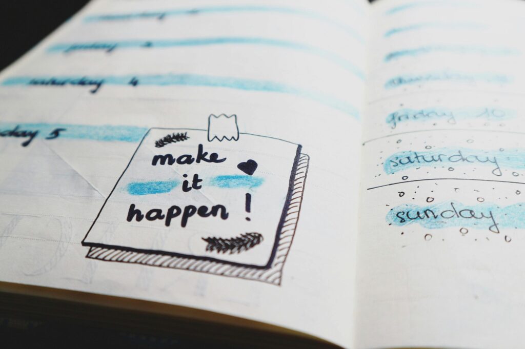 SonderBeaut a notebook open on a page that says "make it happen"